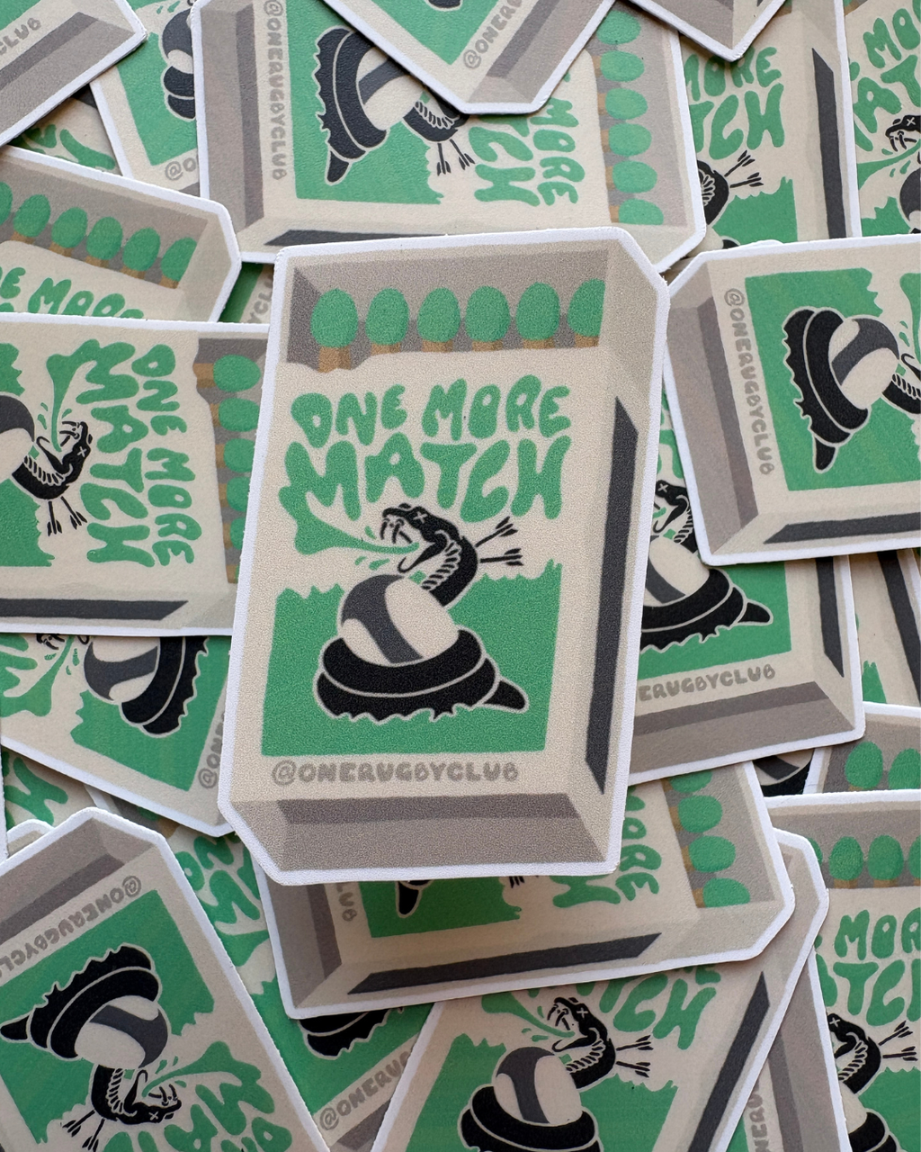 Pile of stickers of matchbox with venomous snake and the words "One more match"